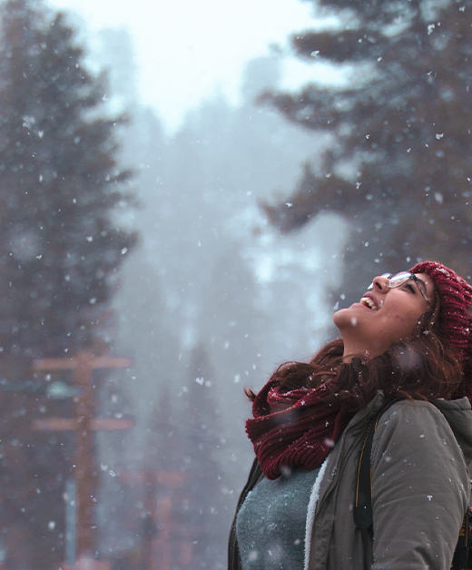 Young woman enjoying the serene Himalayan weather with a smile.